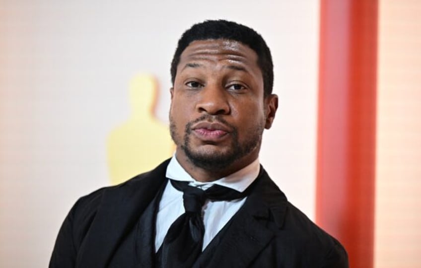 Actor Jonathan Majors, seen at the 2023 Oscars, has avoided jail time after being convicte