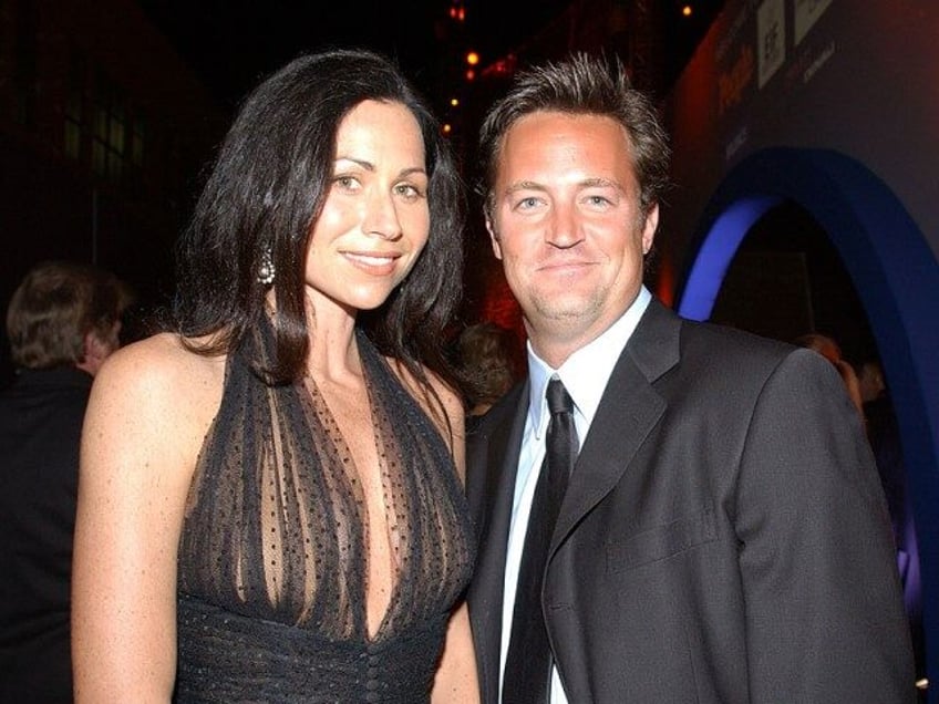 Actors Minnie Driver and Matthew Perry pose during the Entertainment Industry Foundation and People Magazine Screen Actors Guild Post-Awards Gala at the Shrine Auditorium March 10, 2002 in Los Angeles, CA. (Photo by Vince Bucci/Getty Images)