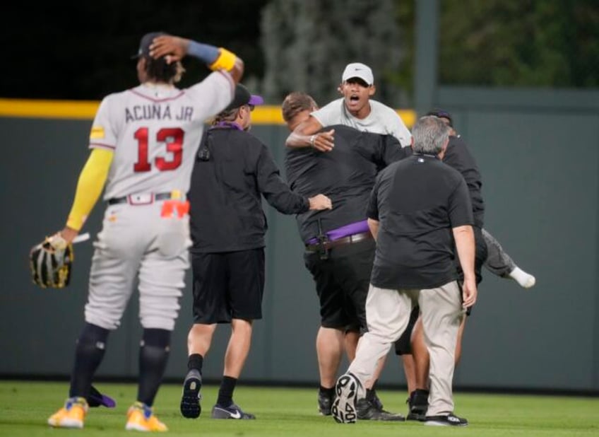 acuna fends off fans ties career highs with 4 hits and 5 rbis in braves 14 4 rout of rockies