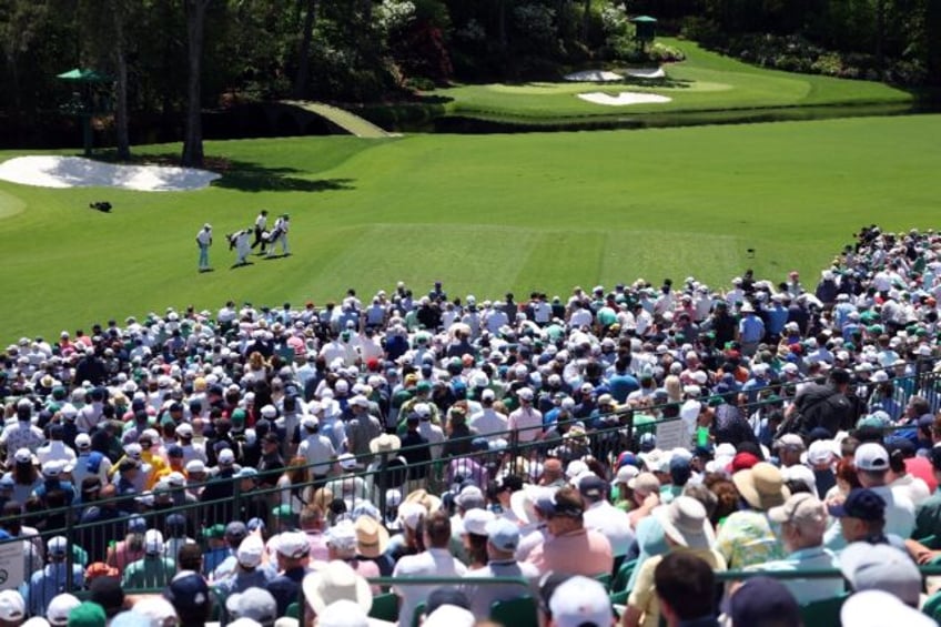 The crowds at Augusta National flocked to watch Tiger Woods on Friday as he made the cut f