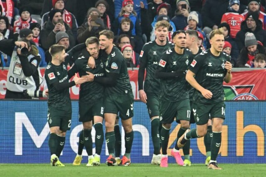 On target: Bremen defender Mitchell Weiser (2ndL) celebrates scoring