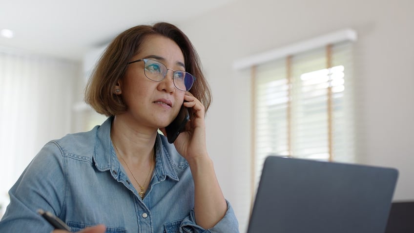 Concerned woman on phone