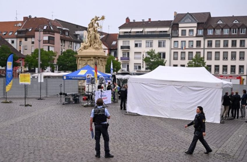 The knifeman initially attacked a speaker and other demonstrators, then stabbed a police o
