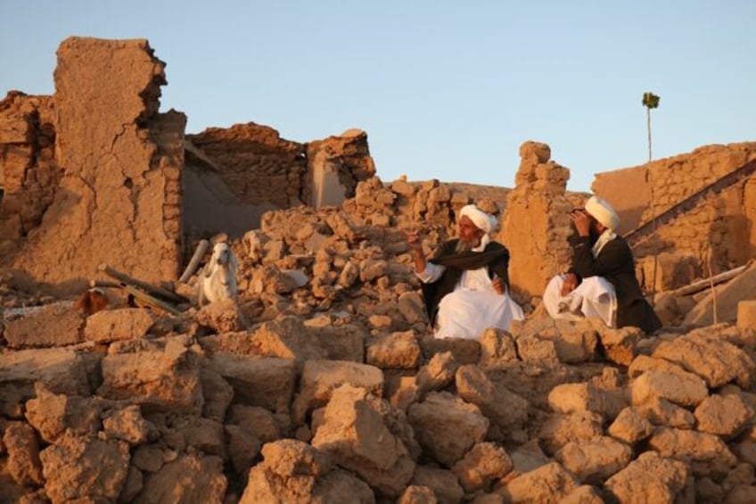 afghan rescuers work through the night after deadly quake