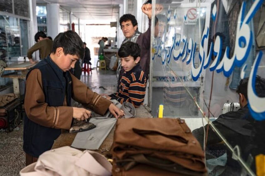 Clothes ironing ahead of Eid al-Fitr, which marks the end of the Muslim holy fasting month