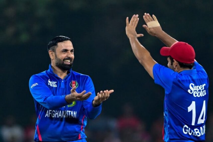 Mohammad Nabi (L) starred with bat and ball for Afghanistan in the third ODI against Irela