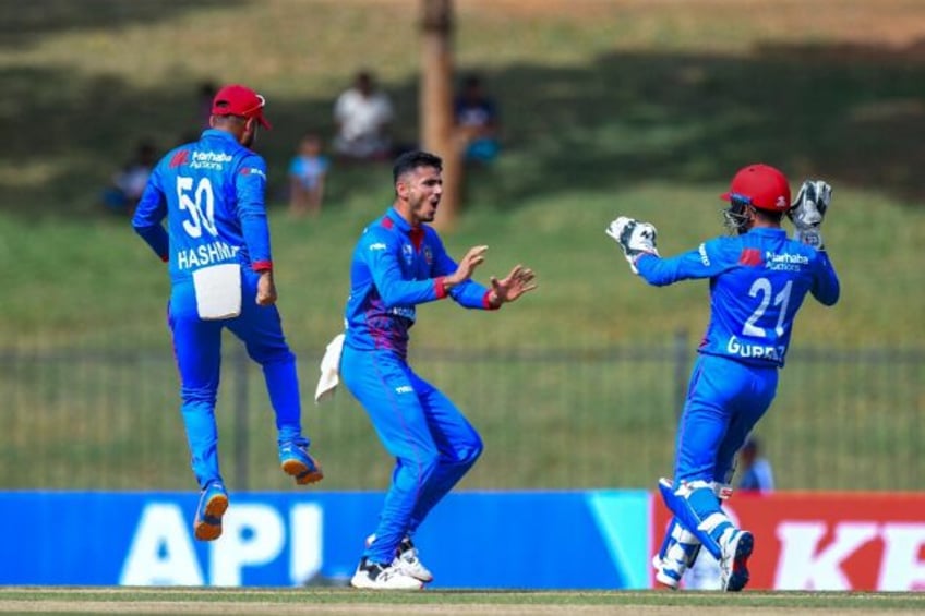 afghanistans spin trio skittle pakistan for 201 in first odi