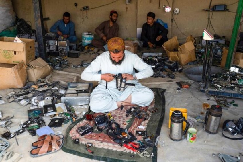 Sitting on the floor of a dilapidated workshop in the Afghan border town of Spin Boldak, a