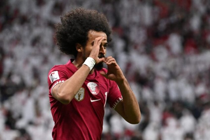 Qatar's forward Akram Afif celebrates after scoring