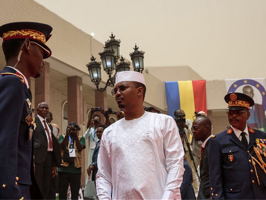 Chad President-elect General Mahamat Idriss Deby Itno (C) arrives for his inauguration at