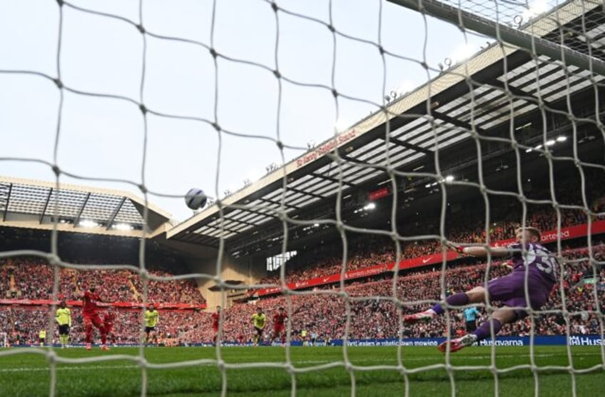 Mohamed Salah converts a penalty to seal a 3-1 Premier League victory for Liverpool over S