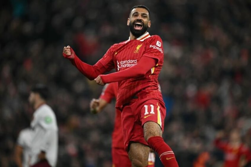 Mohamed Salah celebrates scoring the winner for Liverpool over Wolves.