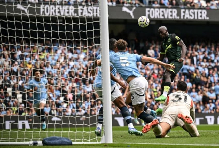 Yoane Wissa (R) heads Brentford into an early lead at Manchester City