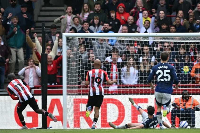 Yoane Wissa (L) scores the fourth Brentford goal in a 4-3 Premier League victory over Manc