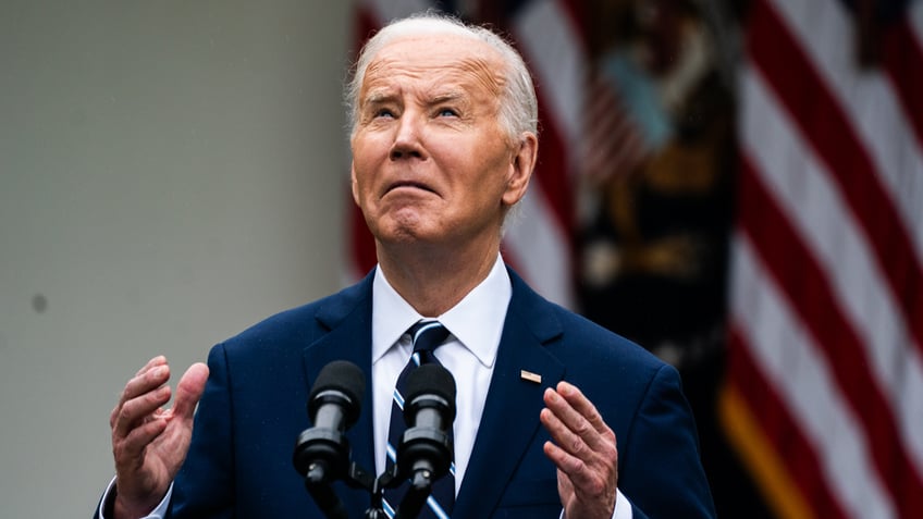 Biden standing in the rain