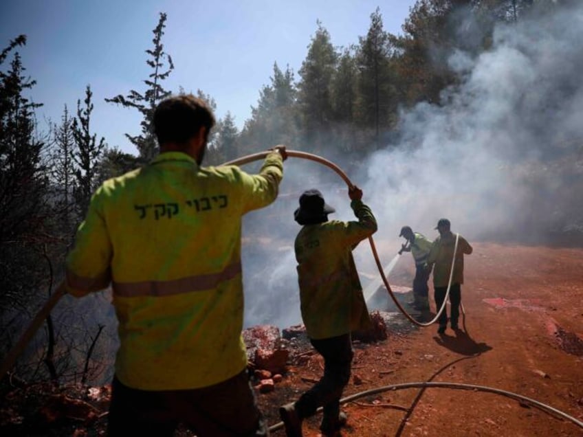 Israeli forestry firefighters try to put out wildfires in the Jerusalem mountains, Tuesday