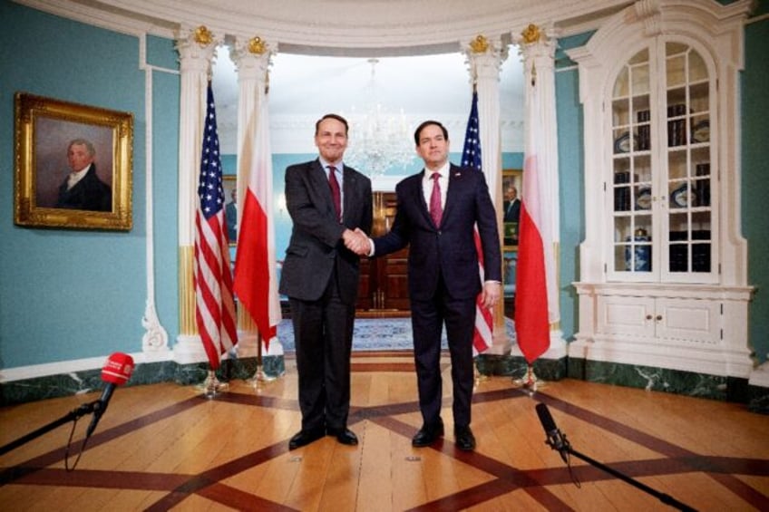 US Secretary of State Marco Rubio (R) greets Polish Foreign Minister Radoslaw Sikorski at