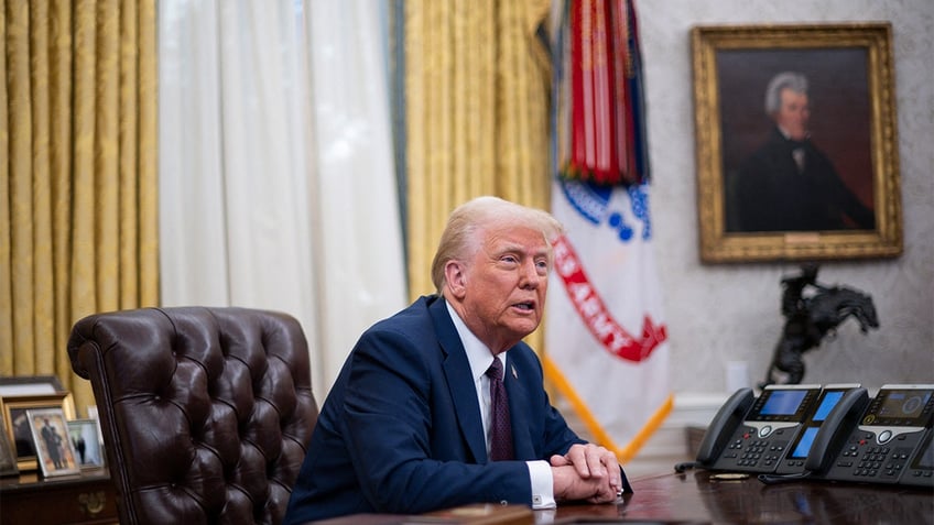 President Donald Trump speaks to the media after signing executive orders in the Oval Office on Jan. 23, 2025.