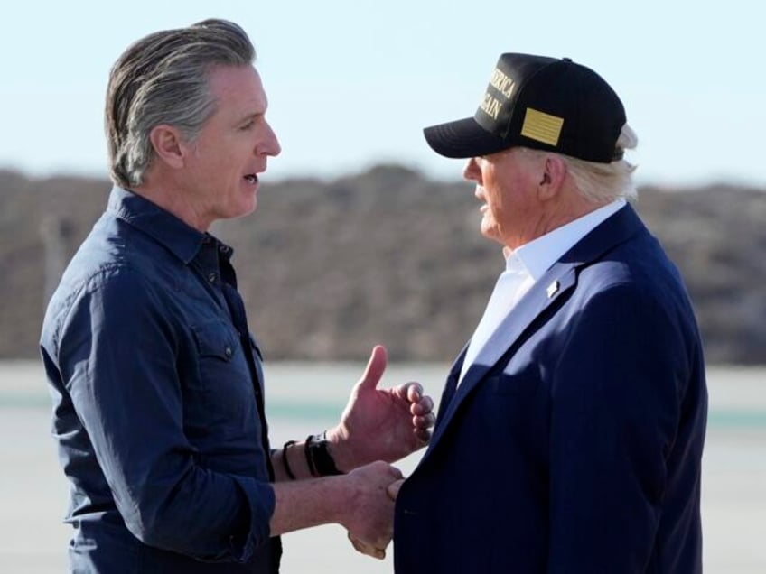 President Donald Trump talks with California Gov. Gavin Newsom after arriving on Air Force