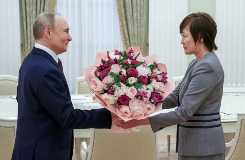 In this pool picture distributed by the Russian state agency Sputnik, Russia's President V