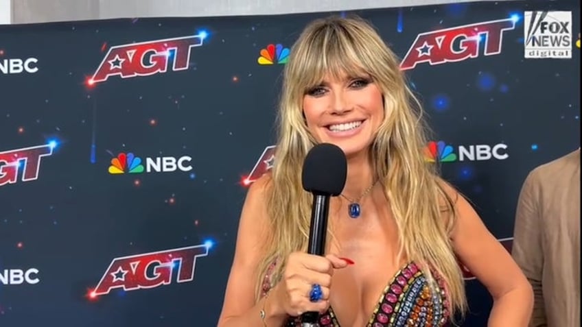 agt judge heidi klum keeps complicated halloween costume top secret after last years worm suit