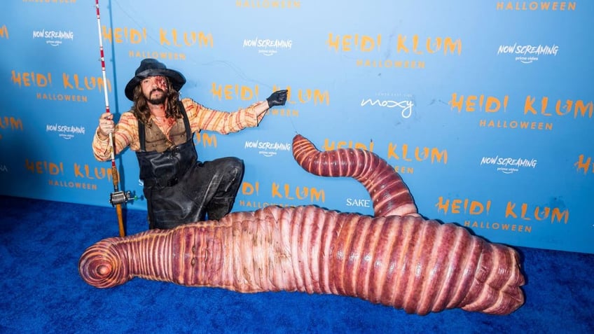 agt judge heidi klum keeps complicated halloween costume top secret after last years worm suit