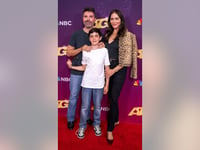 'AGT' judge Simon Cowell has rare public outing with son and fiancée after revealing 10-year-old 'saved' him