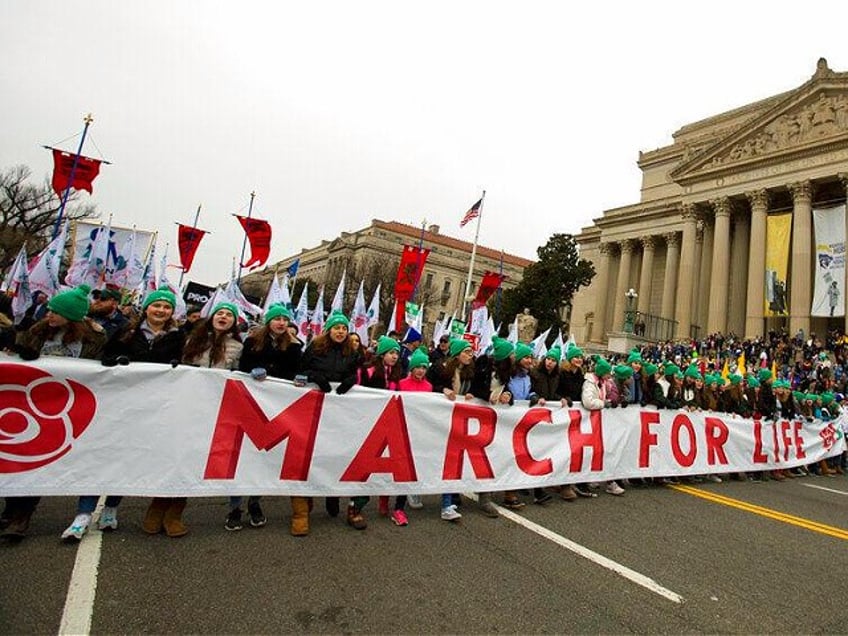 Anti-abortion activists march towards the U.S. Supreme Court during the "March for Life "in Washington, Friday, Jan. 24, 2020. (AP Photo/Jose Luis Magana)