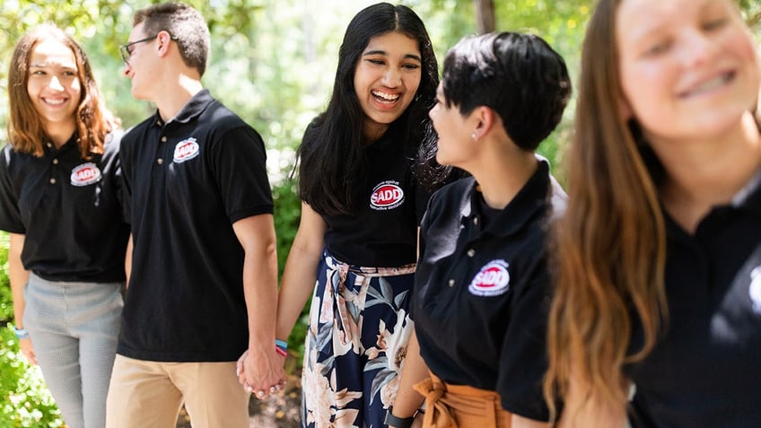 sadd teens hold hands