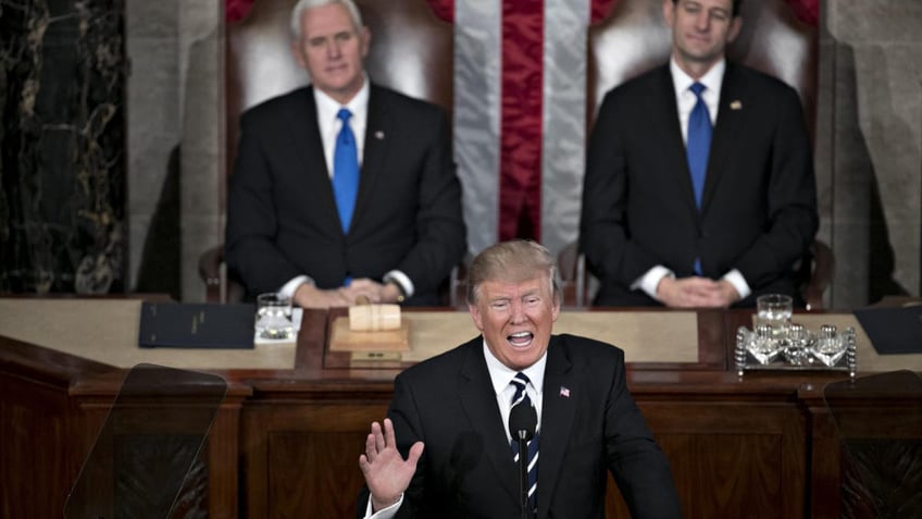 Trump speaking to Congress in 2017 with Pence, Ryan behind him