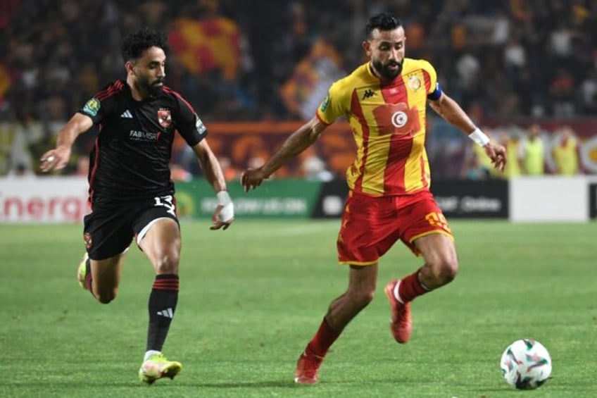 Marwan Attia (L) of Al Ahly challenges Ghaylene Chaalali of Esperance during the first leg