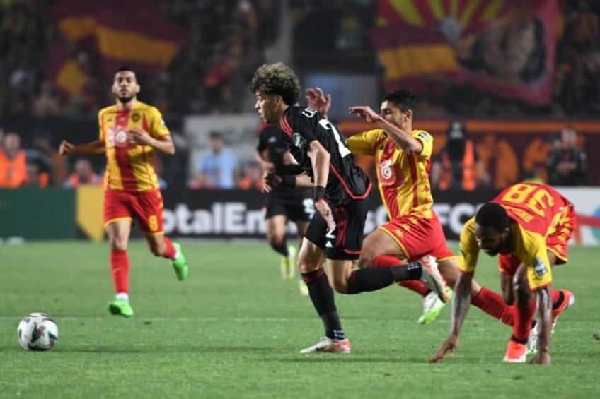 Emam Ashour (C) of Al Ahly attacks during the CAF Champions League final first leg against