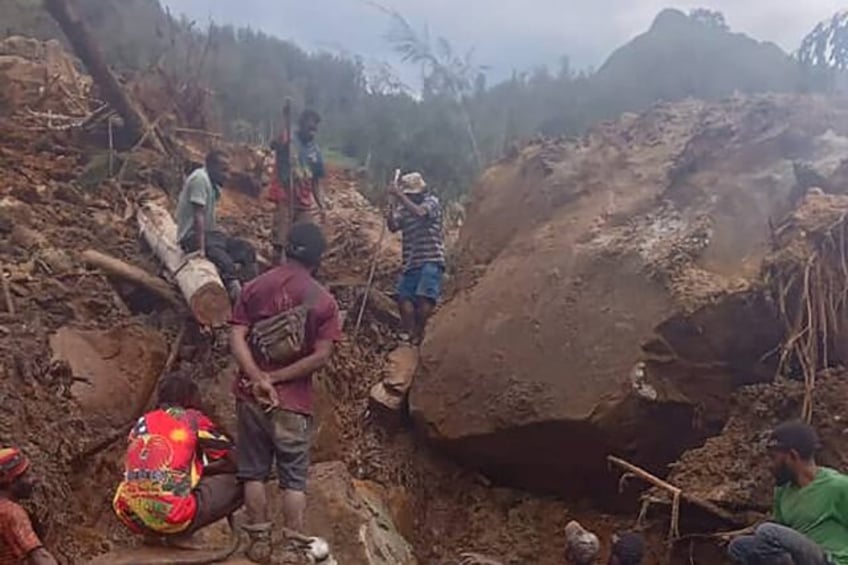 Photo courtesy of local community leader Steven Kandai shows people digging at the site of