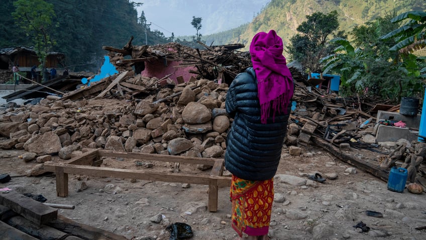 aid trickles in as survivors salvage belongings from rubble in nepal villages struck by earthquake