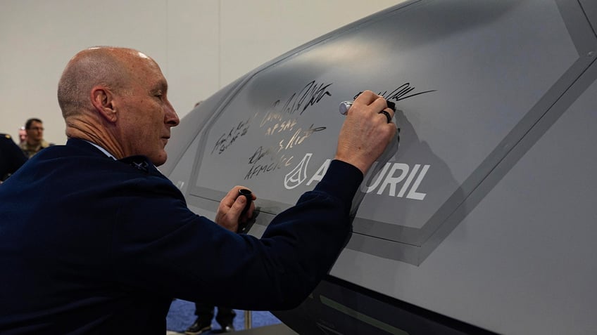 USAF Gen. Allvin signs fighter jet