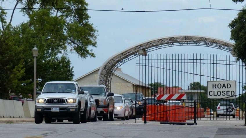 air force police open fire on driver attempting to run gate of texas base