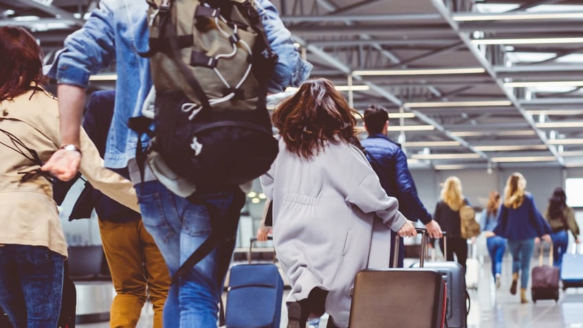 people rushing in airport