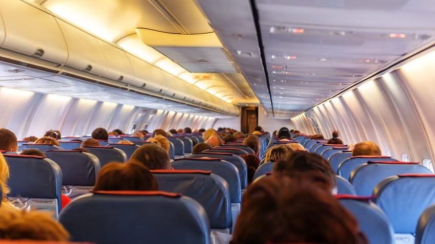 Airplane passengers sitting in seats