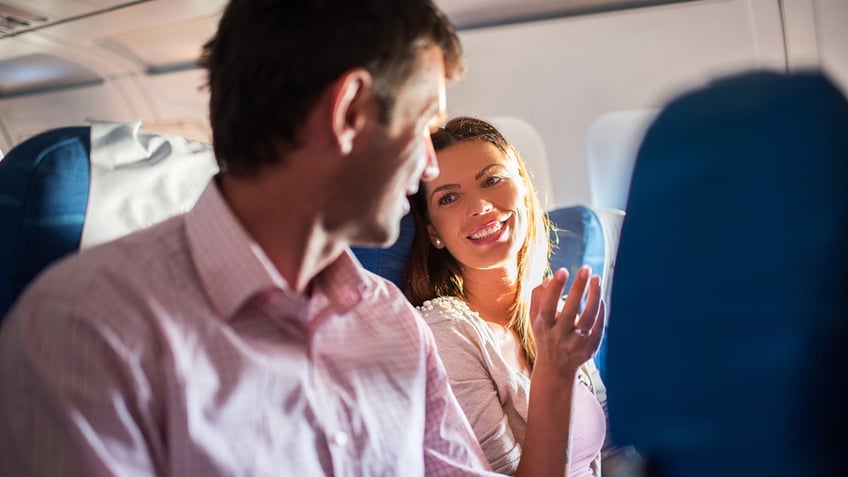 people talking on an airplane