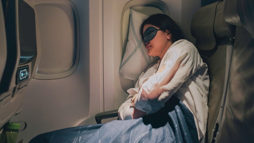 sleeping-on-airplane