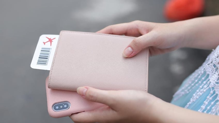 Woman holds passport