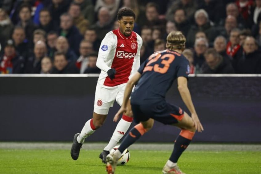 Ajax's English forward Chuba Akpom (L) is heading on loan to Lille with option to buy