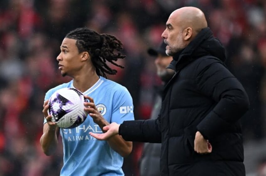 Manchester City's Dutch defender Nathan Ake (L)