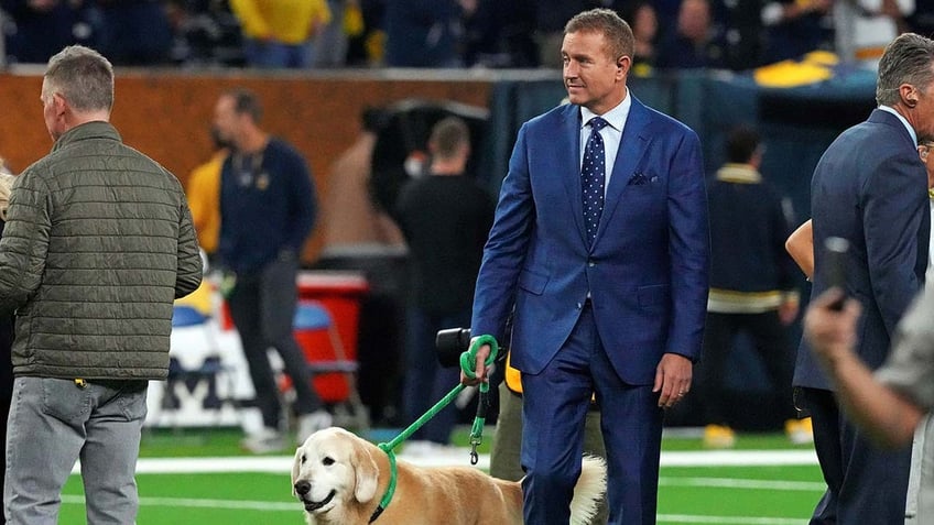 Kirk Herbstreit walks his dog