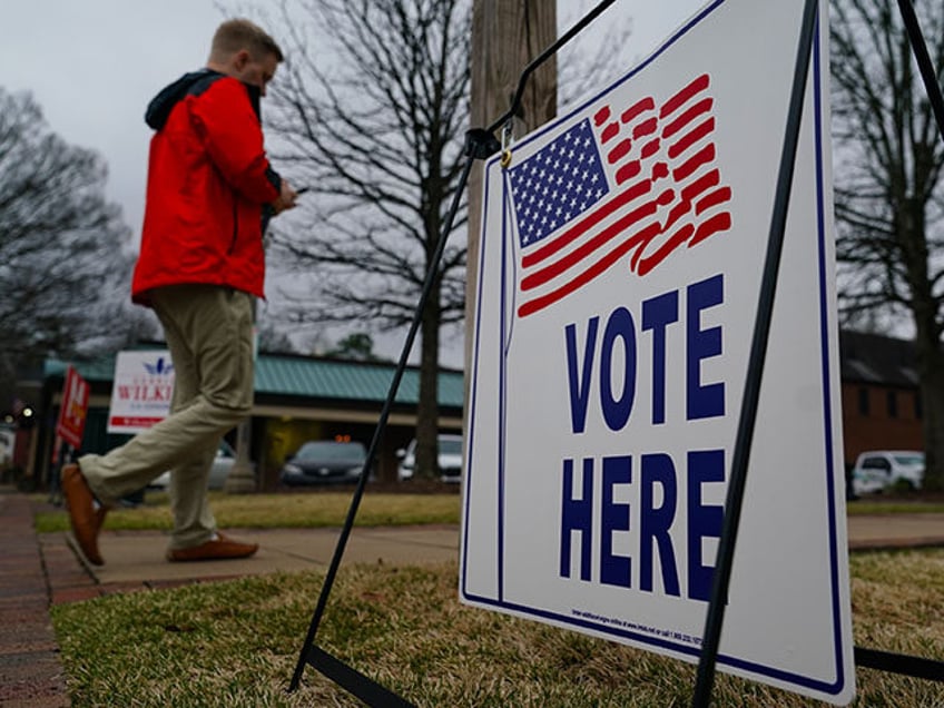 A voter enters a polling place to cast their ballot in the state's primary on March 5, 202