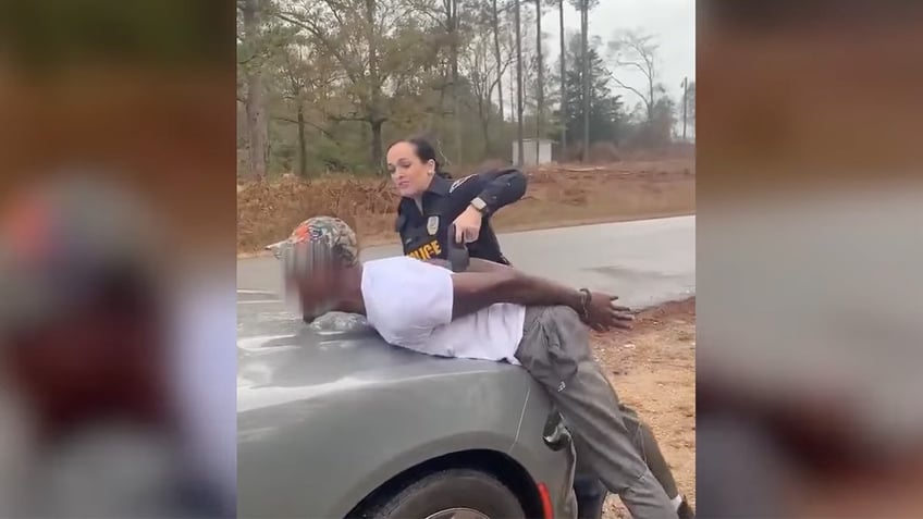 alabama police officer on leave after video shows her using stun gun on handcuffed man