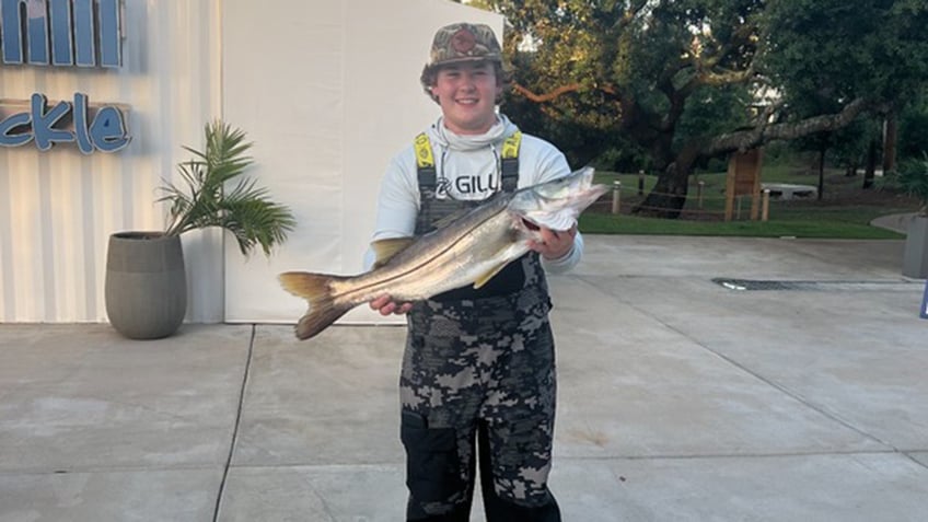 Gardner-holding-fish-record