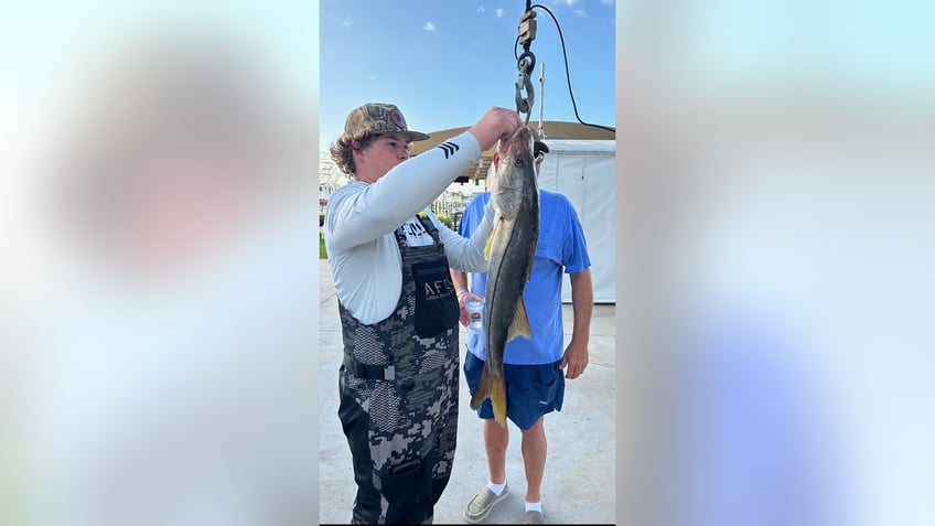 Gardner-Love-looking-at-state-fishing-record