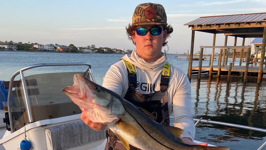 Gardner-holding-fish-record