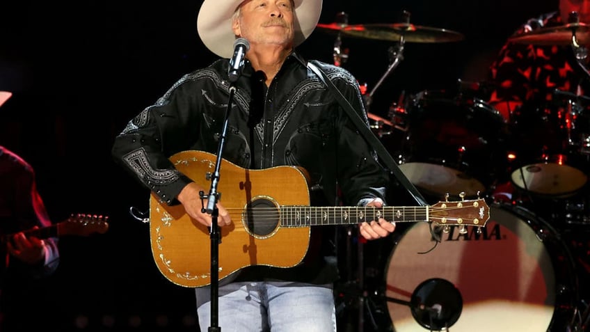 Alan Jackson playing guitar